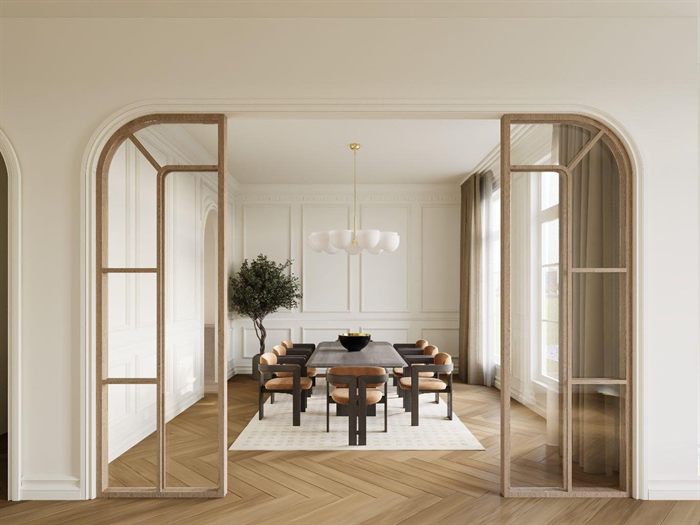 Dining room with arched openings, chandelier, and herringbone wood floor