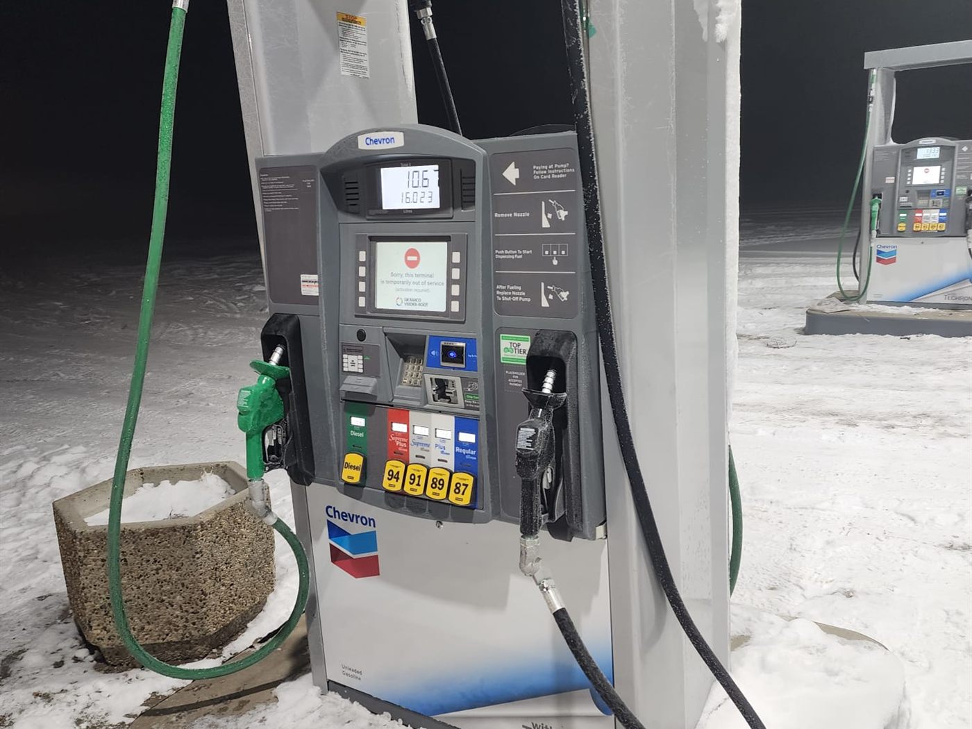 Chevron dispenser with green nozzle and hose detail
