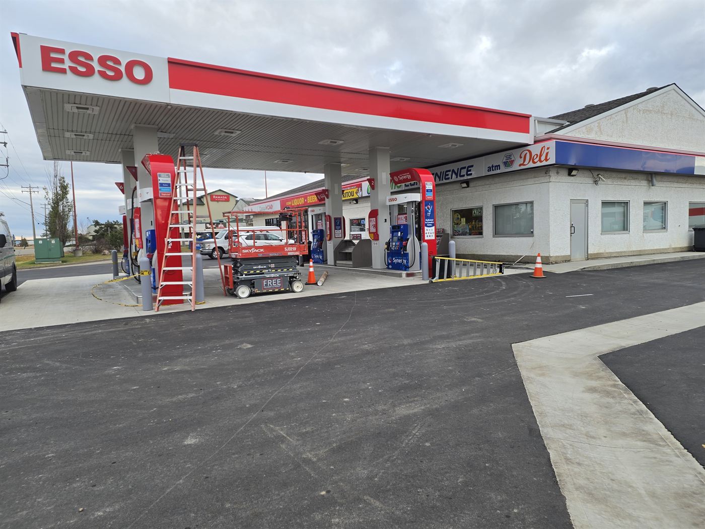 Esso station canopy sign, fuel pumps, and convenience store at the Nisku site