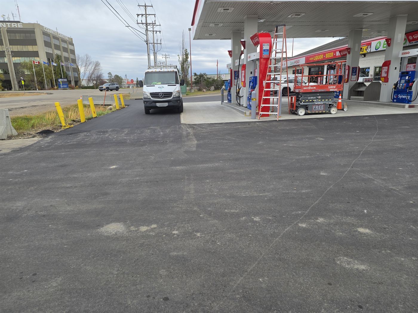 Esso forecourt at Nisku with a work platform and ladders set up during electrical work