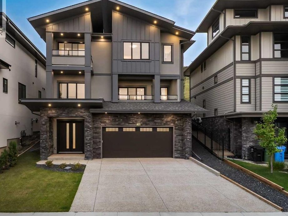 Front elevation of a custom home in Patterson, Calgary at dusk