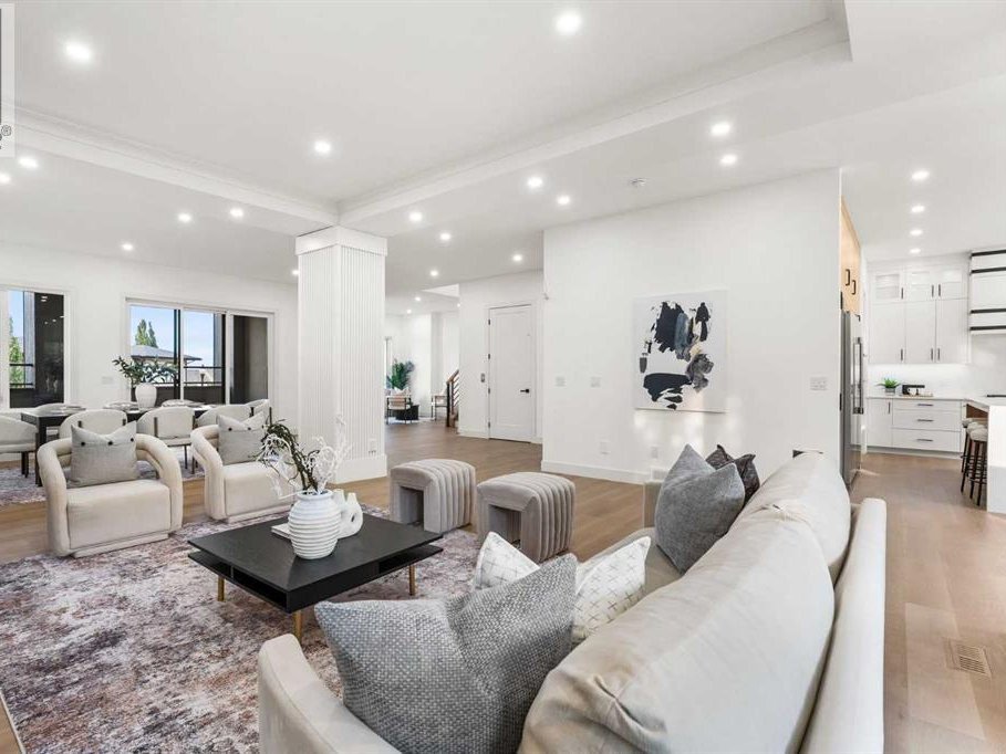Living room with recessed pot lights and open-concept layout